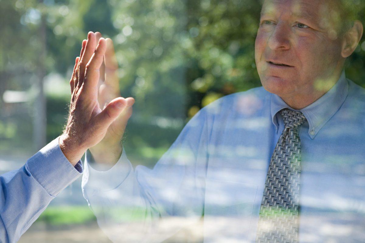 Man looking at his reflection
