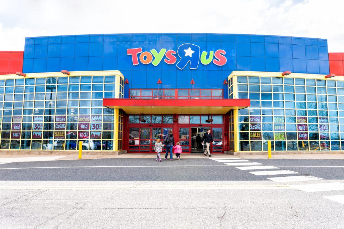 Fairfax, USA - April 5, 2018: Toys R US store shop, Virginia, entrance, promotion, advertising signs, logo, doors, closing going out of business bankruptcy, people, mother, children, family walking
